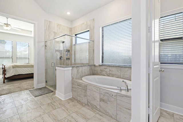 full bathroom with baseboards, a ceiling fan, ensuite bath, a shower stall, and a bath