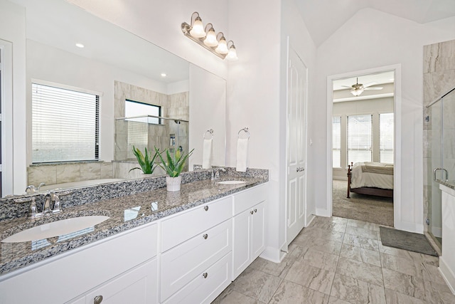 bathroom featuring walk in shower, lofted ceiling, vanity, and ceiling fan