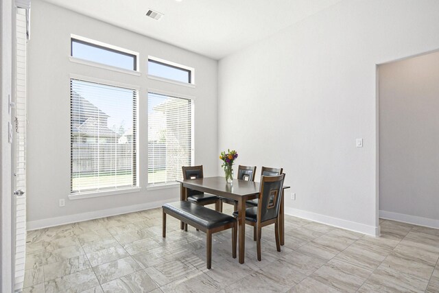 dining room featuring plenty of natural light