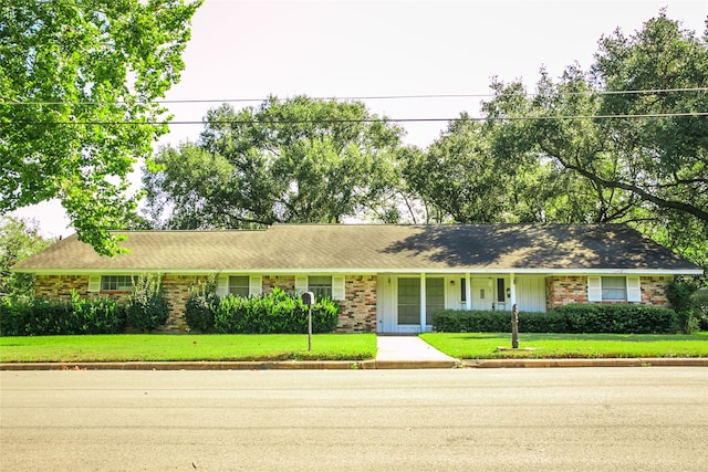 ranch-style house with a front lawn