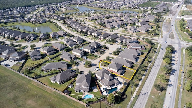 bird's eye view with a water view