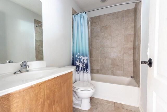 full bathroom with tile patterned flooring, shower / bath combo, vanity, and toilet