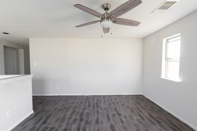 unfurnished room featuring dark hardwood / wood-style flooring and ceiling fan