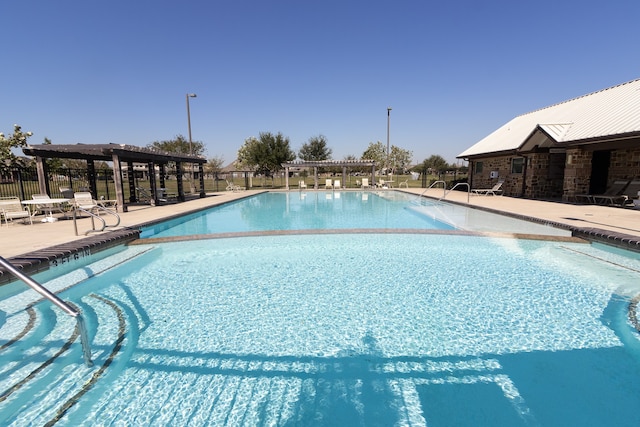 view of pool featuring a patio area