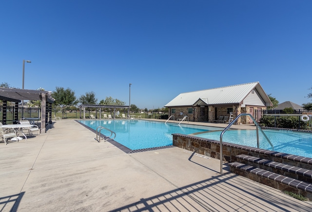 view of swimming pool with a patio