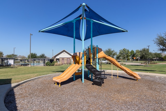 view of jungle gym featuring a lawn