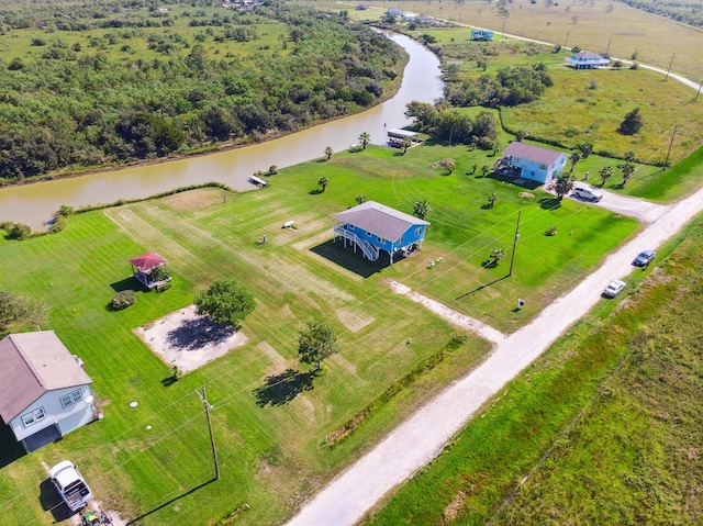 birds eye view of property with a water view and a rural view