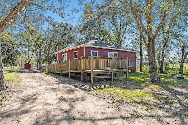 back of house featuring a deck