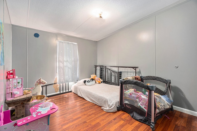 bedroom featuring dark hardwood / wood-style flooring