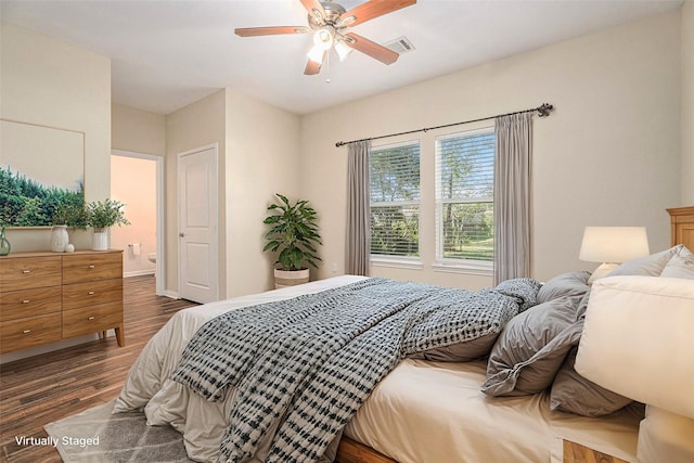 bedroom with ceiling fan and dark wood-type flooring