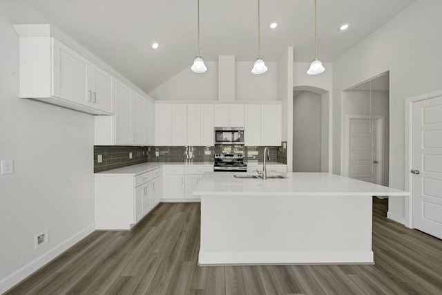 801 Rd 5812, Cleveland, TX 77327 - kitchen featuring stainless steel appliances, a sink, tasteful backsplash, dark wood finished floors, and recessed lighting
