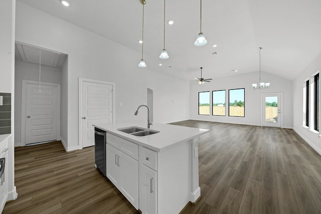 kitchen with white cabinets, a center island with sink, sink, and dark hardwood / wood-style flooring