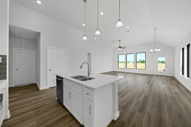 801 Rd 5812, Cleveland, TX 77327 - kitchen featuring a sink, lofted ceiling, stainless steel dishwasher, dark wood-type flooring, and white cabinetry