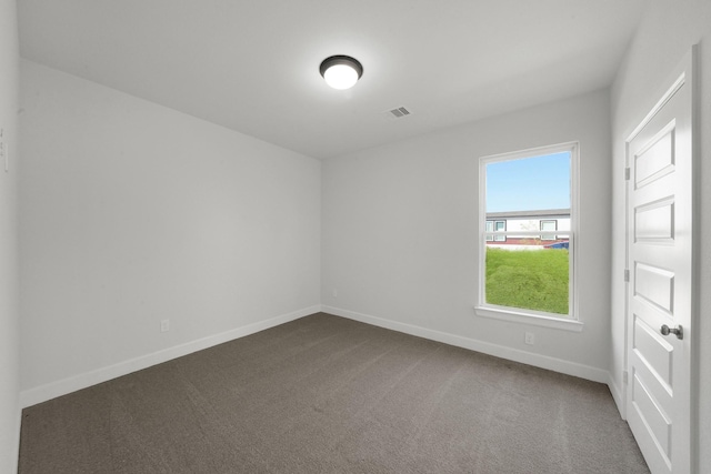 801 Rd 5812, Cleveland, TX 77327 - empty room featuring dark carpet and baseboards