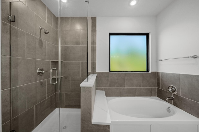 801 Rd 5812, Cleveland, TX 77327 - full bath featuring a bath, a shower stall, and recessed lighting