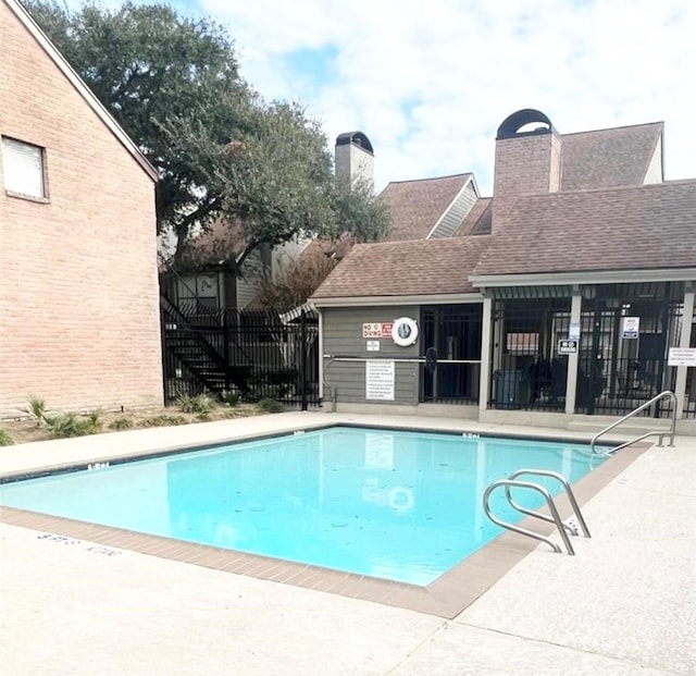 view of swimming pool featuring a patio area