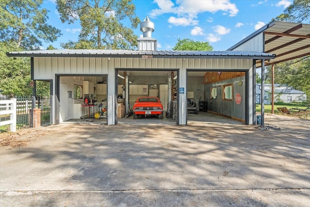 exterior space with a garage and a carport