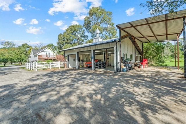 exterior space featuring a carport and a garage