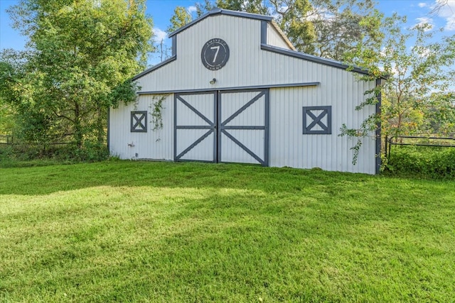 view of outdoor structure with a yard