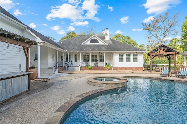 view of swimming pool with an in ground hot tub, a gazebo, and a patio area