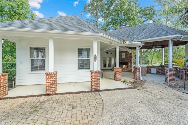 exterior space with ceiling fan