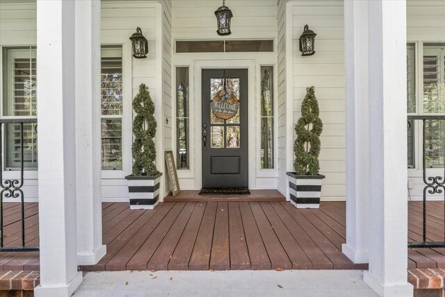 doorway to property featuring a porch