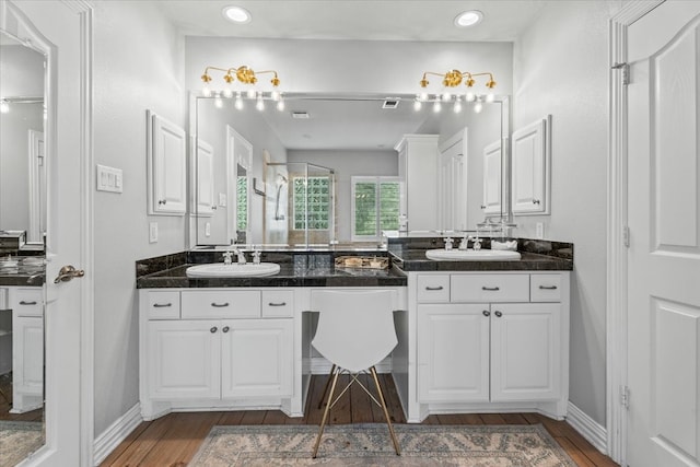 bathroom featuring hardwood / wood-style floors and vanity