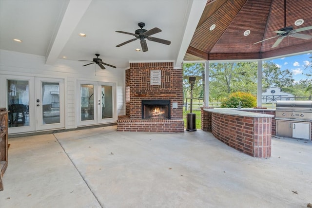 view of patio with a grill, french doors, area for grilling, and ceiling fan