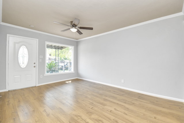 entrance foyer with light hardwood / wood-style flooring, ceiling fan, and crown molding