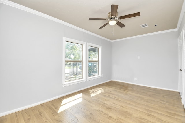 spare room with light hardwood / wood-style floors, ornamental molding, and ceiling fan