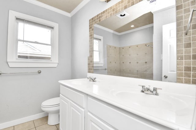 bathroom featuring a shower, tile patterned floors, crown molding, vanity, and toilet