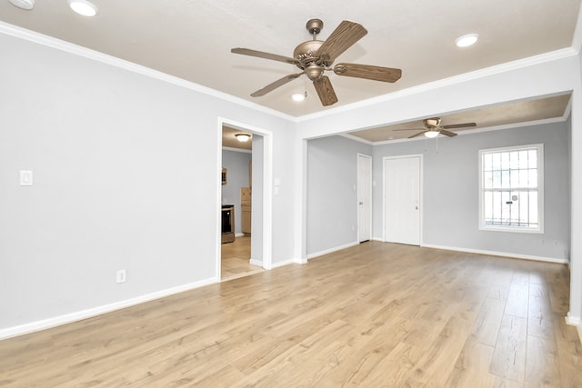 spare room with ornamental molding, light hardwood / wood-style floors, and ceiling fan