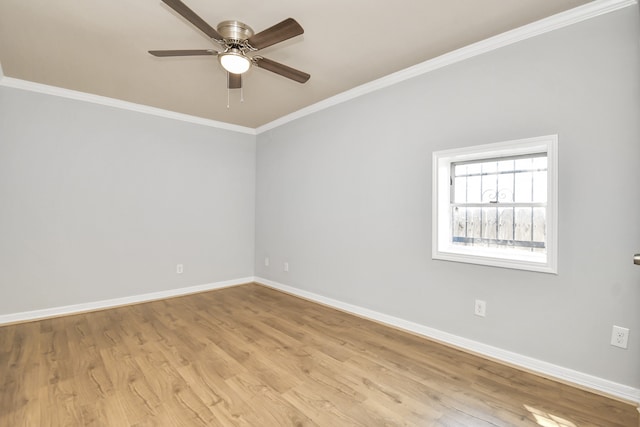 spare room featuring light hardwood / wood-style floors, ornamental molding, and ceiling fan