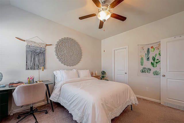 carpeted bedroom featuring vaulted ceiling and ceiling fan