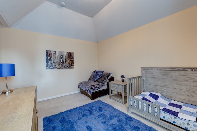 carpeted bedroom featuring lofted ceiling