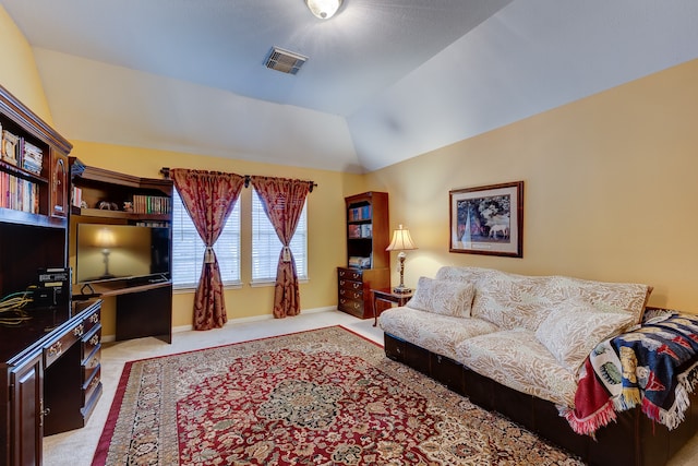 living room with light colored carpet and vaulted ceiling