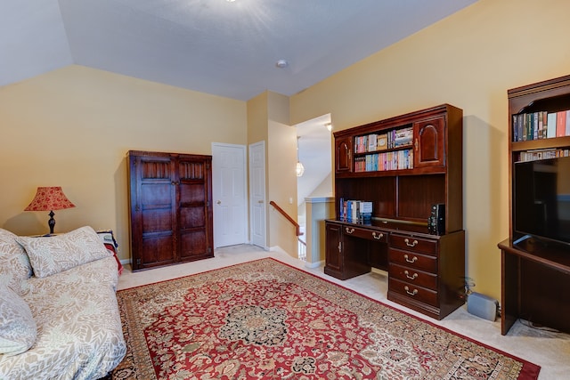 interior space with light carpet and vaulted ceiling