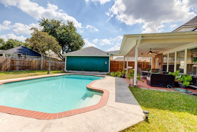 view of pool with a lawn, ceiling fan, and a patio