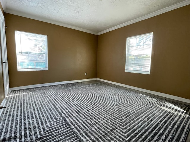 unfurnished room with a textured ceiling, plenty of natural light, and crown molding