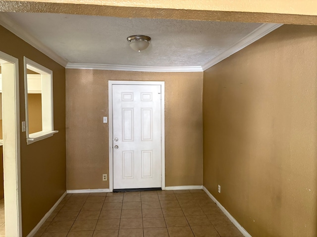 tiled foyer entrance featuring crown molding