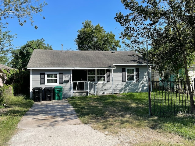 ranch-style house with a front yard