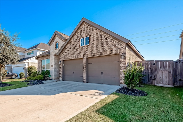 front of property featuring a garage and a front lawn