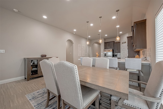 dining space featuring light wood-type flooring