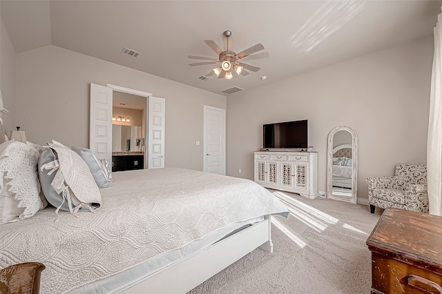 bedroom featuring connected bathroom, carpet, ceiling fan, and vaulted ceiling