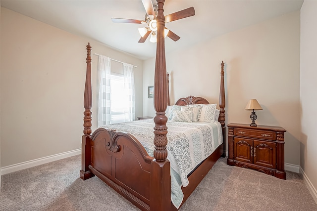 bedroom featuring ceiling fan and light carpet