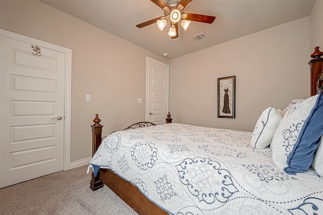 carpeted bedroom featuring ceiling fan and lofted ceiling