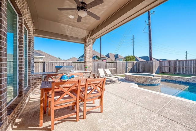 view of patio / terrace with a pool with hot tub and ceiling fan