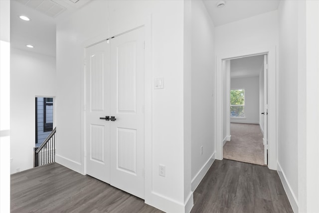 hall with dark hardwood / wood-style flooring