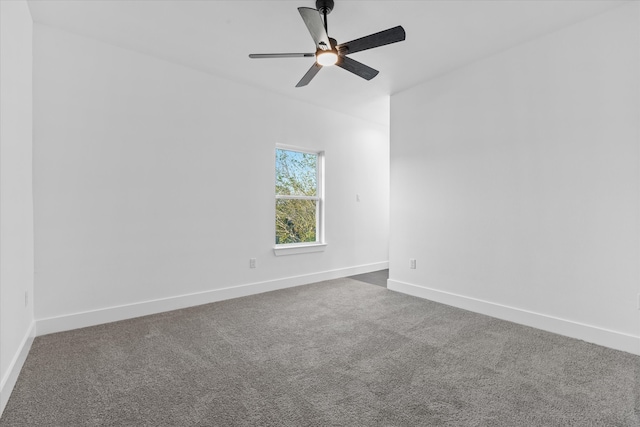 unfurnished room featuring ceiling fan and carpet flooring