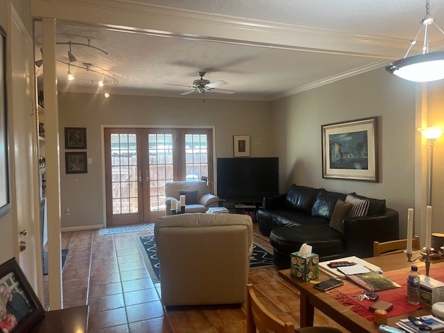 tiled living room with french doors, crown molding, and ceiling fan